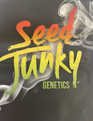 Seed Junky Genetics logo with smoky background and gradient red-to-green text.